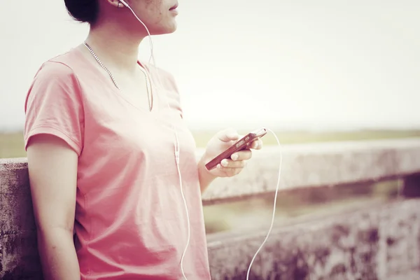 Young girl listening to music