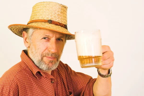 Elderly guy with a mug of beer