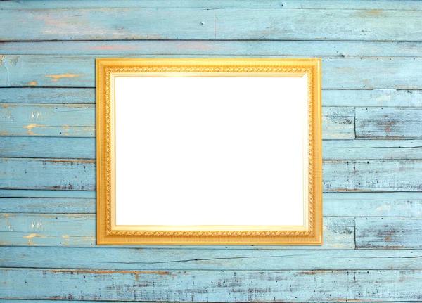 Gold Vintage picture frame on blue wood background