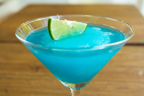 Frozen Blue Margarita Cocktail in martini glass