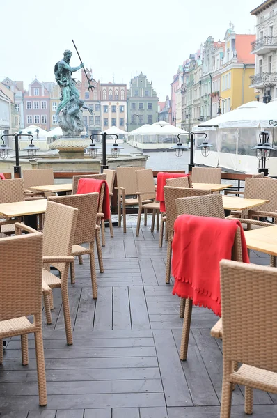 Street view of a empty coffee terrace with tables and chairs in old town of Antalya, Turkey