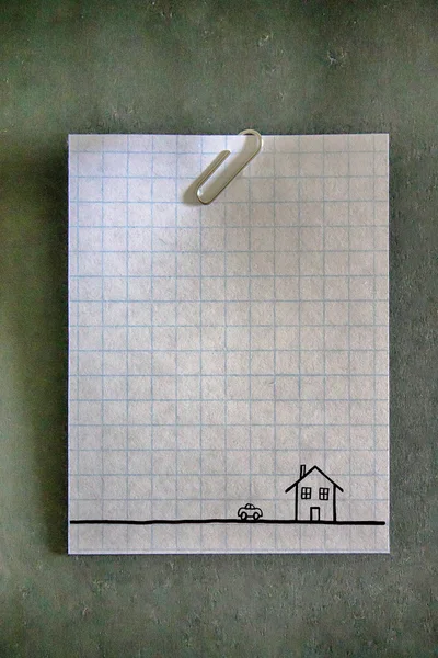 Paperclip on an empty white grid paper