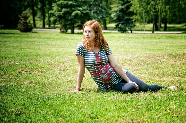 Pregnant woman in park
