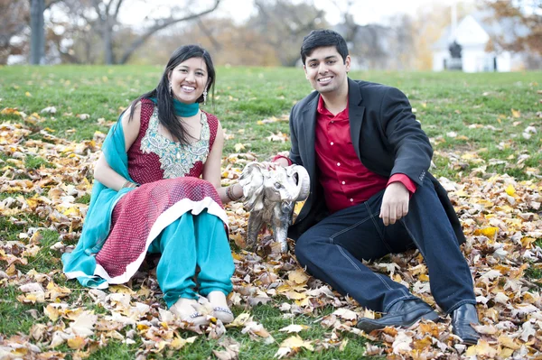 A Young Happy Indian Couple Posing With Elephant