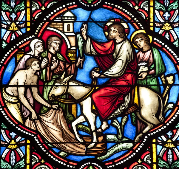 BRUSSELS - JUNE 22: Entry of Jesus in Jerusalem. Detail from windowpane in st. Michael s gothic cathedral on June 22, 2012 in Brussels.