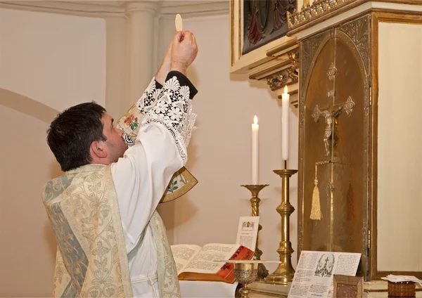 Priest with the eucharist at tridentine mass
