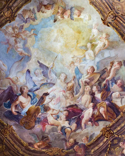 VIENNA - JULY 3: Baroque angel choirs fresco from ceiling one of side chapel in Michaelerkirche or st. Michael church on July 3, 2013 Vienna.