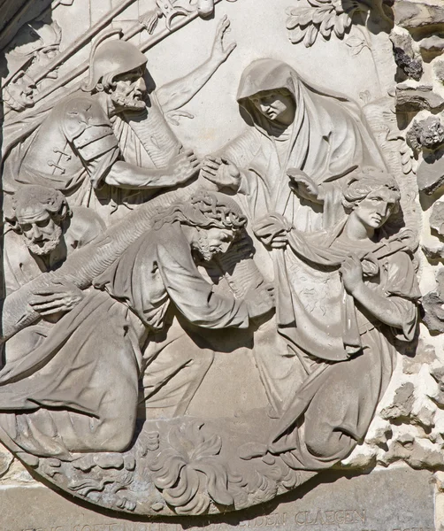 ANTWERP, BELGIUM - SEPTEMBER 5: Stone relief of Jesus fall under the cross from calvary beside St. Pauls church (Paulskerk) on September 5, 2013 in Antwerp, Belgium.