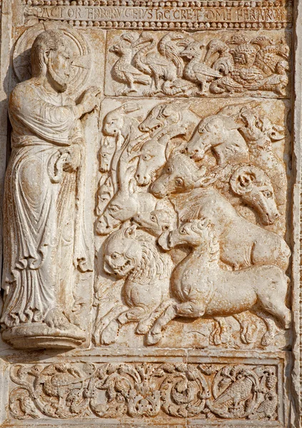 VERONA - JANUARY 27: Relief of creation from facade of romanesque Basilica San Zeno. Reliefs is work of the sculptor Nicholaus and his workshop on January 27, 2013 in Verona, Italy.