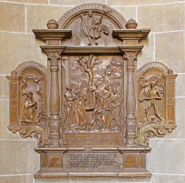 VIENNA, AUSTRIA - FEBRUARY 17, 2014: Stone relief from back side of Church of the Teutonic Order or Deutschordenkirche (1524) with the central scene as Jesus heal the woman.