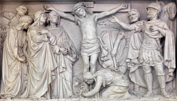 MECHELEN, BELGIUM - JUNE 14, 2014: Stone relief the Crucifixion of Jesus in church Our Lady across de Dyle.