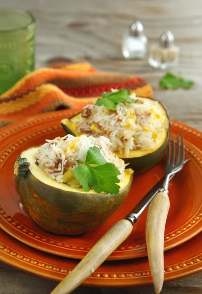 Baked acorn squash with rice and chicken stuffing