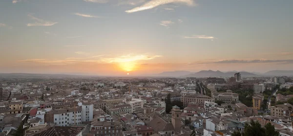 Beautiful panoramic photo overviewing the modern city of Granada at sunset. Blue cloudy sky. Andalusia. Spain.