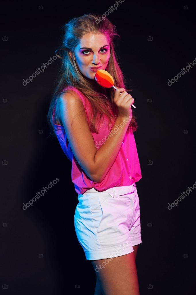 Retro 80s Fashion Disco Girl With Blonde Hair And Lollipop Blac Retro 80s Fashion Disco Girl With Blonde Hair And Lollipop Black Background Photo By Ysbrand