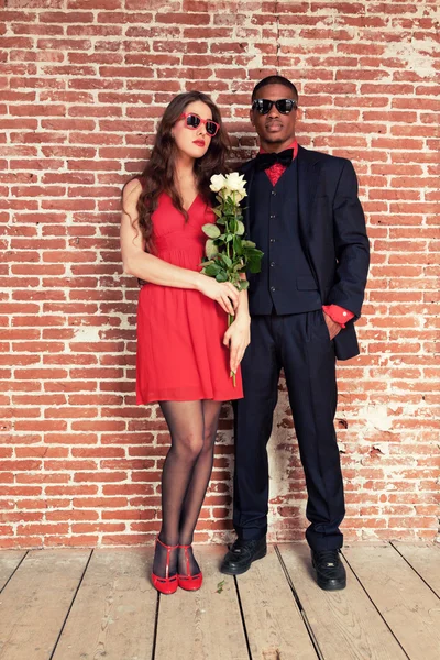 Urban cool retro fashion mixed race wedding couple wearing black