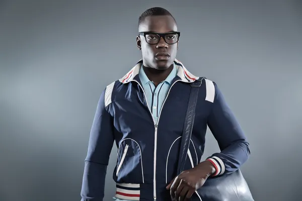 Retro college fashion black african man wearing blue jacket, lea