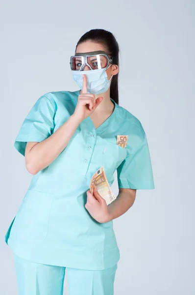 Nurse or doctor in pilot glasses with mask and money