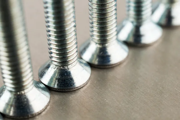 An even number of heads of metal bolts