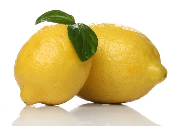 Two lemons isolated over white background