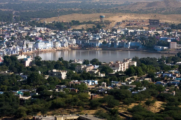 PUSHKAR, INDIA - NOVEMBER 18: people at ritual washing in the holy lake on November 18,2012 in Pushkar, India. A ritual bath in the lake is considered to lead one to salvation.