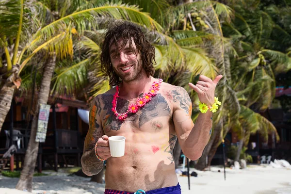 The guy on the beach of Haad Rin after the Full Moon party. Thailand.