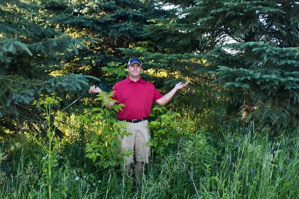 Golfer has lost his golf ball in the woods