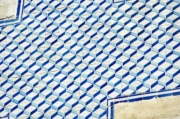 Blue and white tile on the wall in Lisbon, Portugal