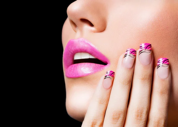 Beautiful girl with pink lips and nails