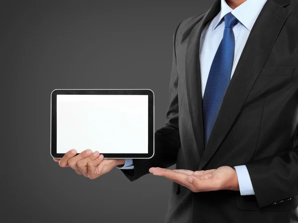 Photo of a businessman showing blank tablet PC monitor