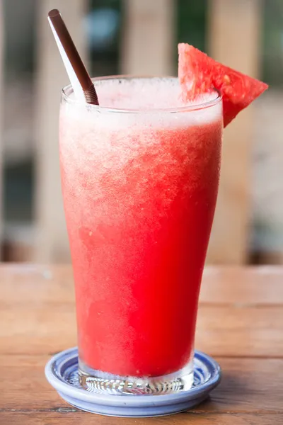 Red water melon fruit juice frappe on wood table