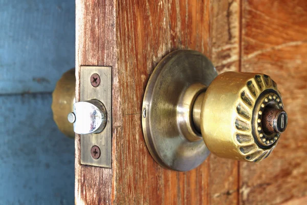 Metal handle on a wooden door