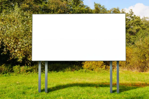 Empty billboard standing in a field