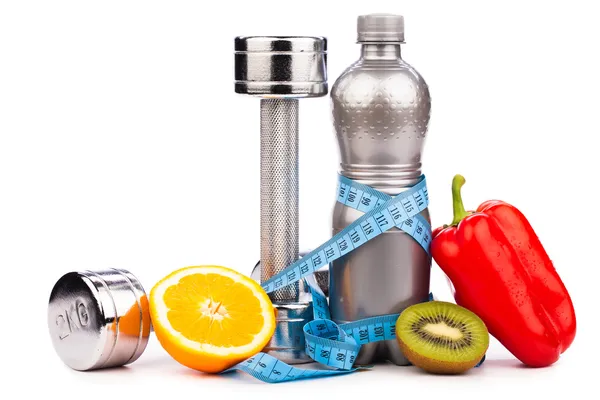 Fitness equipment with fruits and bottle of energy drink isola