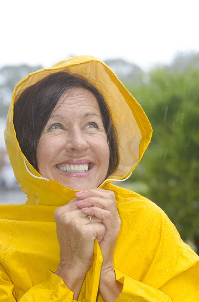 Happy smiling woman in rain