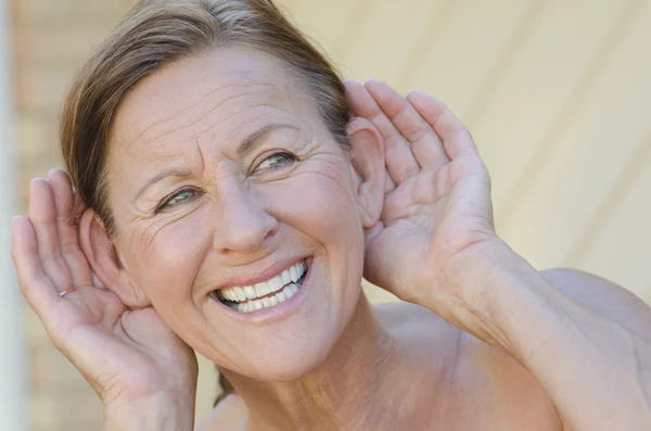Woman hand to ear listening isolated outdoor III