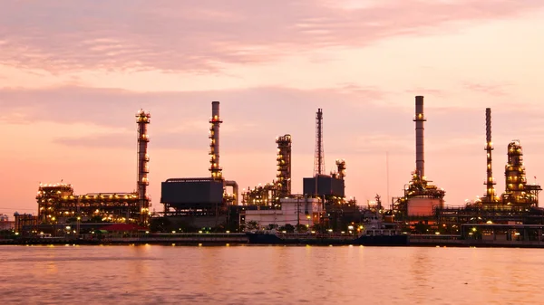 Petroleum oil refinery factory over sunrise
