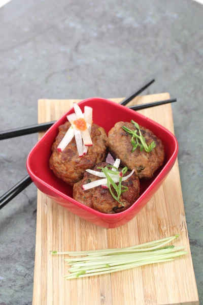 Asian Meatballs in a Red Bowl