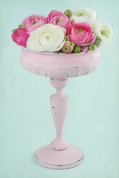 Flowers in an elegant pink tall vase