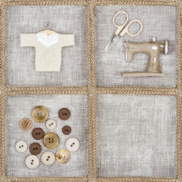 Sewing items on rustic linen background