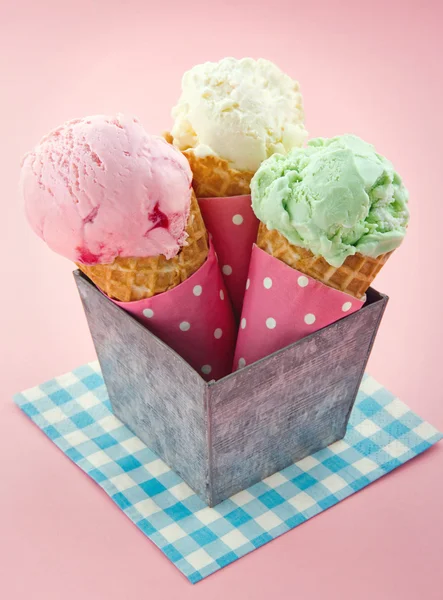 Cones of ice cream on pink vintage background