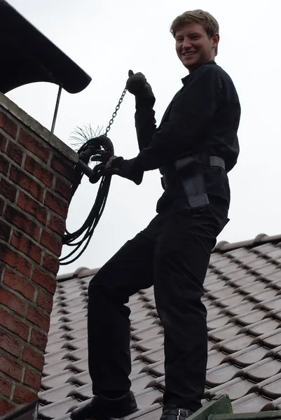 Chimney sweep enjoy to work on the roof