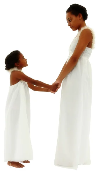 Beautiful black mother daughter portrait holding hands face to f