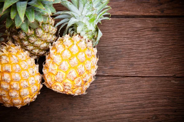 Pineapple on wooden table