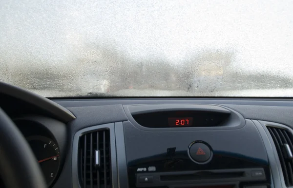 Frosen windscreen of car whole of rime