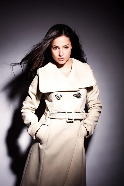 Woman in white modern coat
