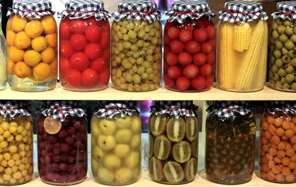 Various preserved fruits and vegetables in jars