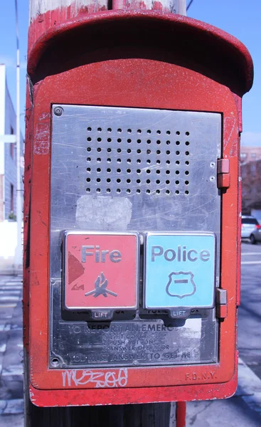 Emergency Reporting System box with buttons to notify the police and fire department