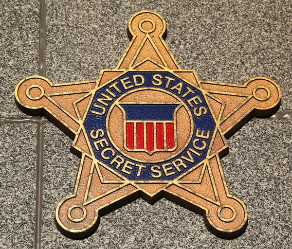 US Secret Service emblem on fallen officers memorial in Brooklyn, NY.