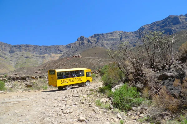 Tour bus climbing at Sani Pass trail between South Africa and Lesotho
