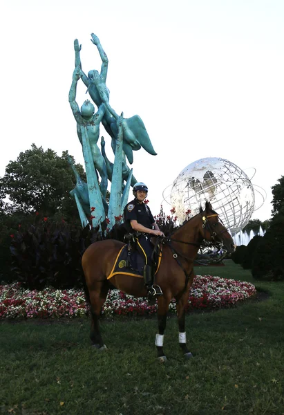 NYPD police officer on horseback ready to protect public at Billie Jean King National Tennis Center during US Open 2013